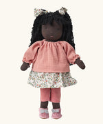  Käthe Kruse Waldorf Doll Nia with long black hair and black skin. Pink knitted jumper, floral print skirt with matching hair bows, red and white stripe leggings and pink booties with white bows.