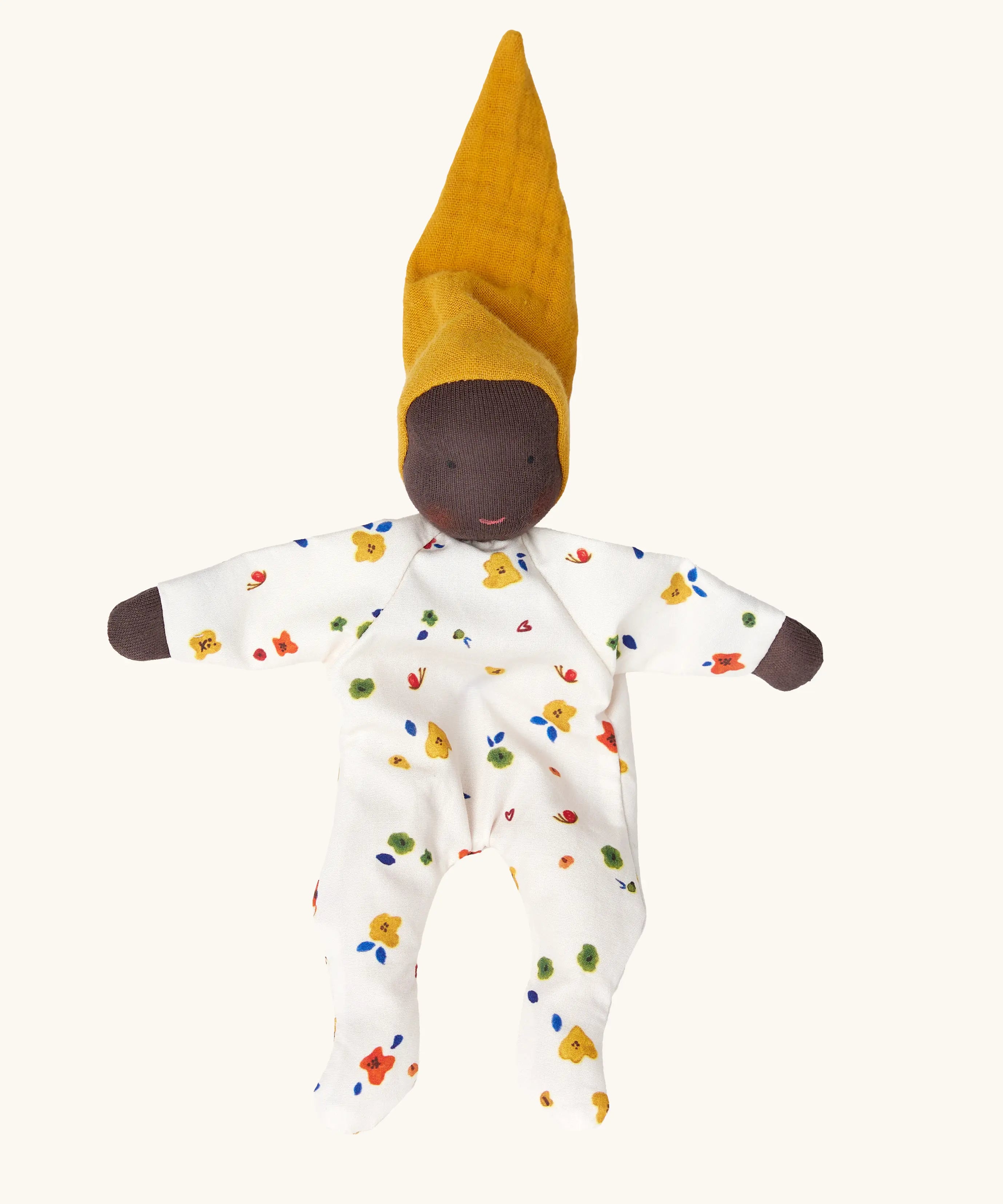 Käthe Kruse Waldorf Doll Nini Sunshine. Washable cotton toy with white floral print outfit and ocre yellow hat with dark skin.