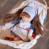 Käthe Kruse Waldorf doll Tilda placed in a dolls pram. 