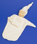Käthe Kruse natural white small Waldorf Imp doll baby comforter made with cotton muslin with one arm folded in.
