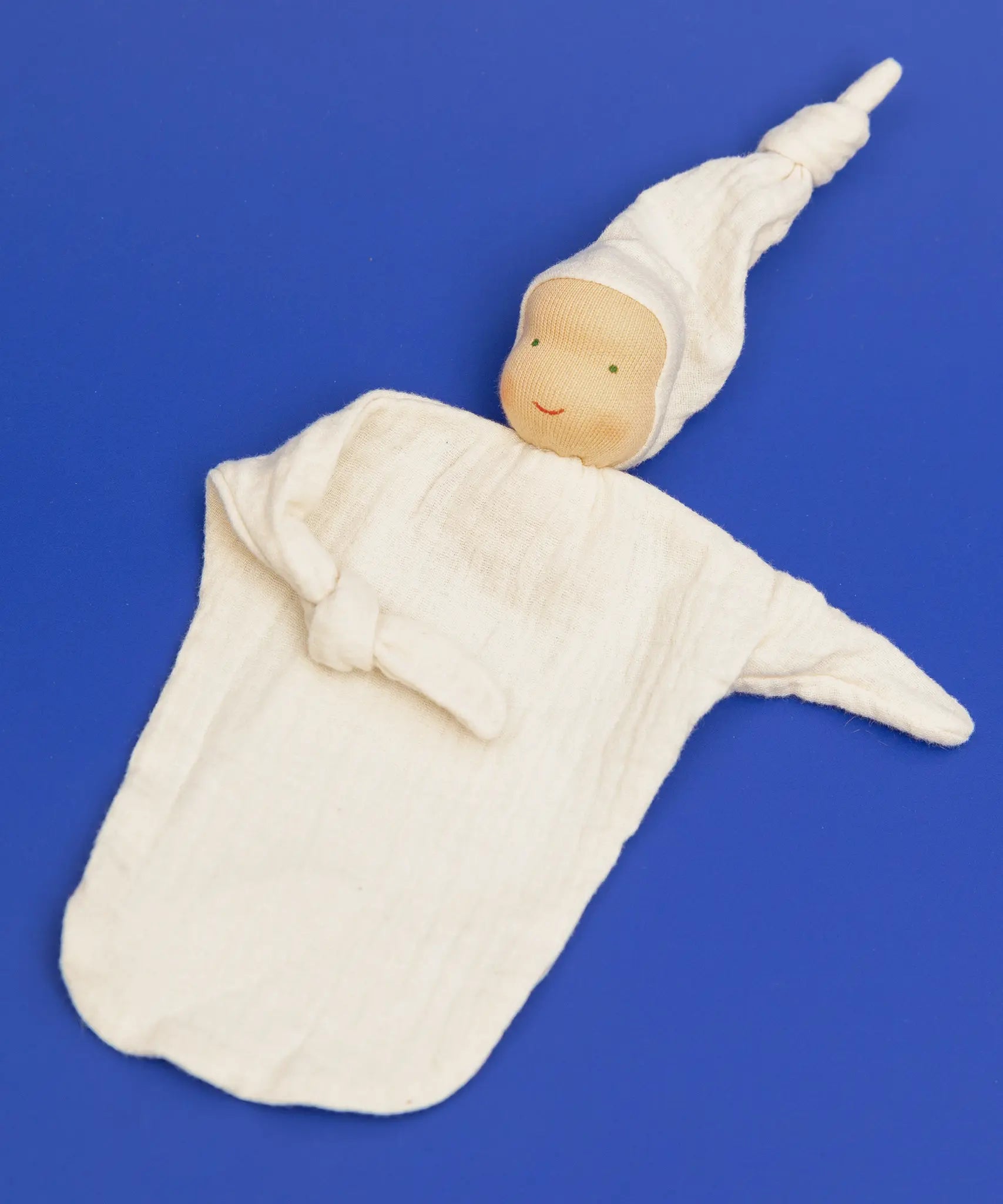 Käthe Kruse natural white small Waldorf Imp doll baby comforter made with cotton muslin with one arm folded in.