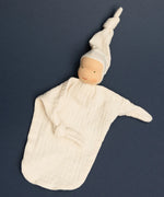Käthe Kruse small Waldorf Imp doll baby comforter in natural white made with cotton muslin with one arm folded in.