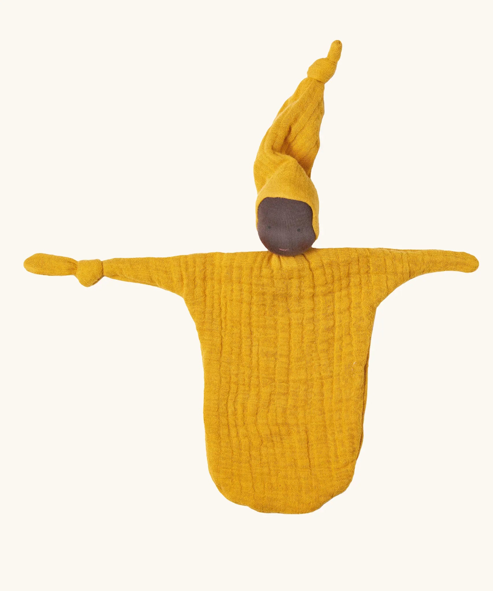 Käthe Kruse small Waldorf Imp comforter doll with ochre yellow outfit and hat and dark skin. 