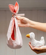 Käthe Kruse white duckling nest Animal music box soft toy. Small duckling soft toy with a white red spotted material nest.