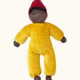 Kathe Kruse Saffron nana waldorf doll with yellow towelling outfit, red hat and dark skin