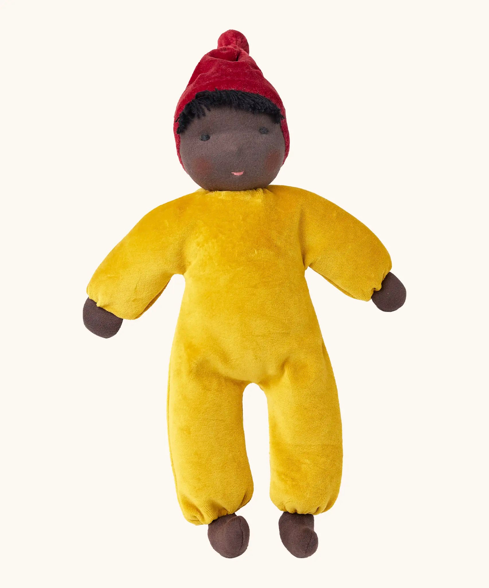 Kathe Kruse Saffron nana waldorf doll with yellow towelling outfit, red hat and dark skin
