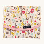 Keep Leaf food wrap in bloom design. A cream colour organic cotton wrap for food with cute flowers printed all over and light pink trim. Features a velcro lid for easy fastening