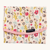 Keep Leaf food wrap in bloom design. A cream colour organic cotton wrap for food with cute flowers printed all over and light pink trim. Features a velcro lid for easy fastening