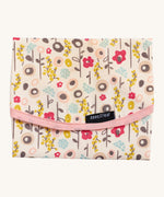 Keep Leaf food wrap in bloom design. A cream colour organic cotton wrap for food with cute flowers printed all over and light pink trim. Features a velcro lid for easy fastening