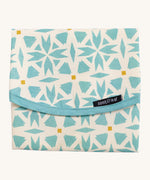 Keep Leaf food wrap in geo design. A cream colour organic cotton wrap for food with blue geo shapes printed all over and light pink trim. Features a velcro lid for easy fastening