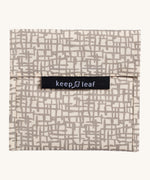 Keep Leaf large baggie in mesh design. A cream colour organic cotton pouch for food with grey mesh lines printed all over. Features a velcro lid for easy fastening