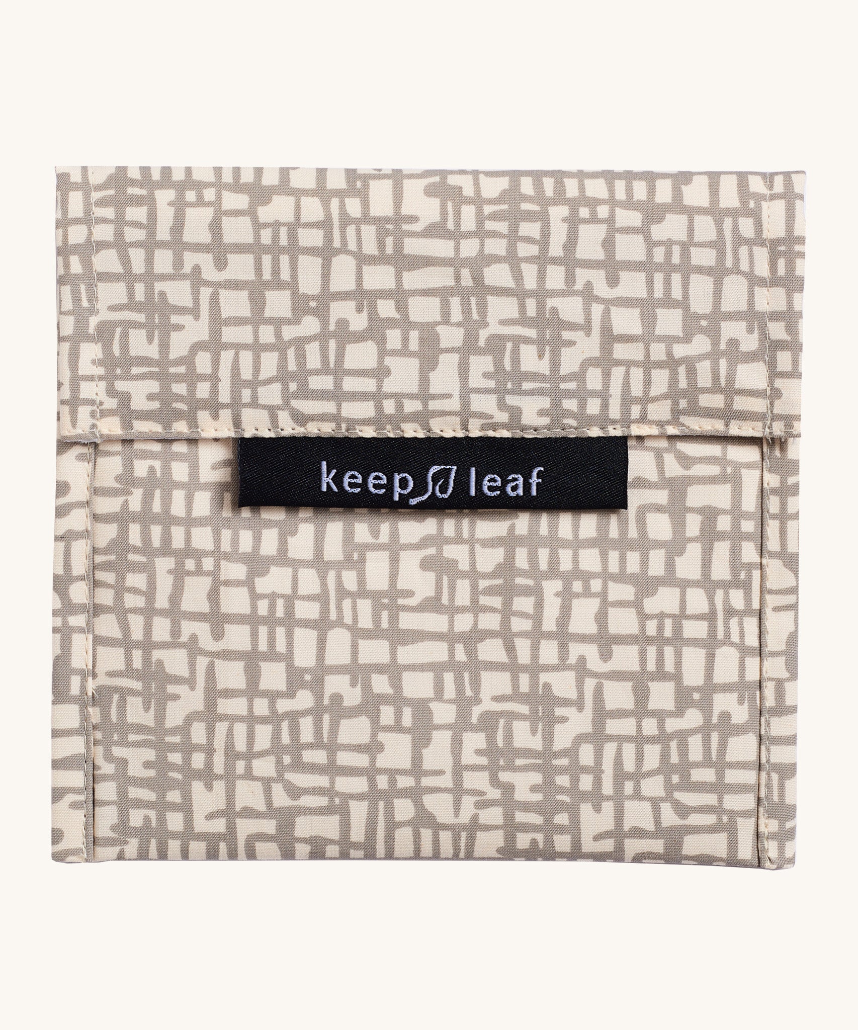 Keep Leaf large baggie in mesh design. A cream colour organic cotton pouch for food with grey mesh lines printed all over. Features a velcro lid for easy fastening