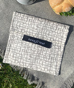 A close up of the organic cotton mesh Keep Leaf large baggie outside on a blanket.