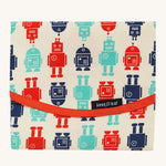 Keep Leaf food wrap in robot design. A cream colour organic cotton wrap for food with playful red and blue robots printed all over and red trim. Features a velcro lid for easy fastening