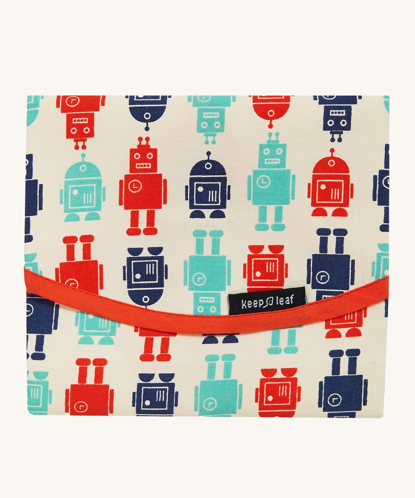 Keep Leaf food wrap in robot design. A cream colour organic cotton wrap for food with playful red and blue robots printed all over and red trim. Features a velcro lid for easy fastening