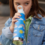 A child drinking from a Rainbow print Kid Kanteen 12oz Insulated Flip Seal Sport Cap Bottle. 