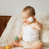 A closer look at the yellow and white balls from the Sophie The Giraffe - Once Upon A Time 5 Senses Musical Balls