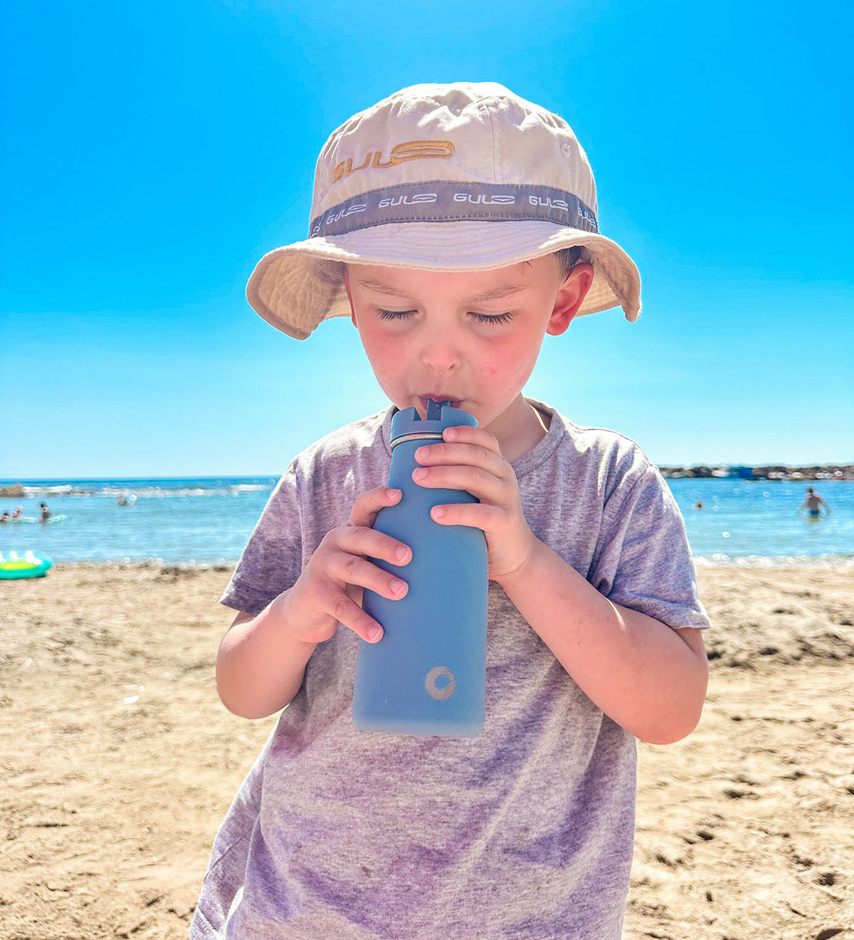 A child enjoying a day out on the beach in the sun