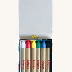 The Kitpas Bird rice bran wax crayons, in bright primary colours as well as green, white, and black.