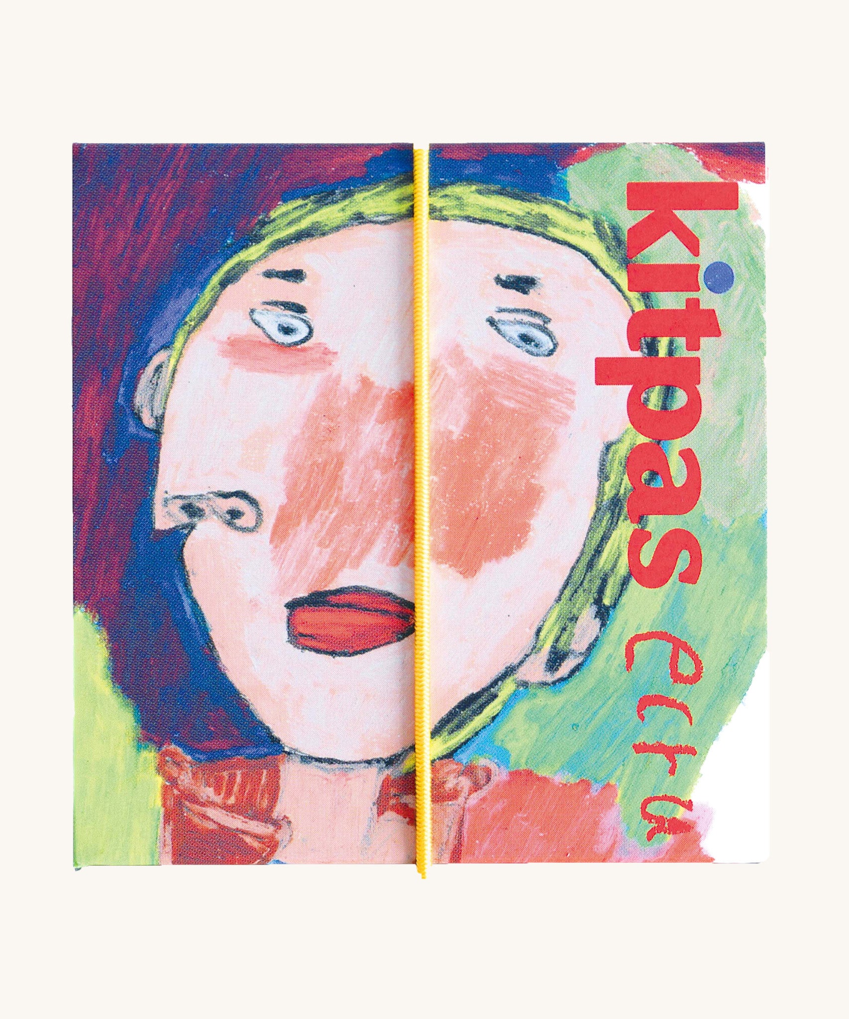 The Kitpas rice bran wax crayons box, with a drawing of a face by Ecru.