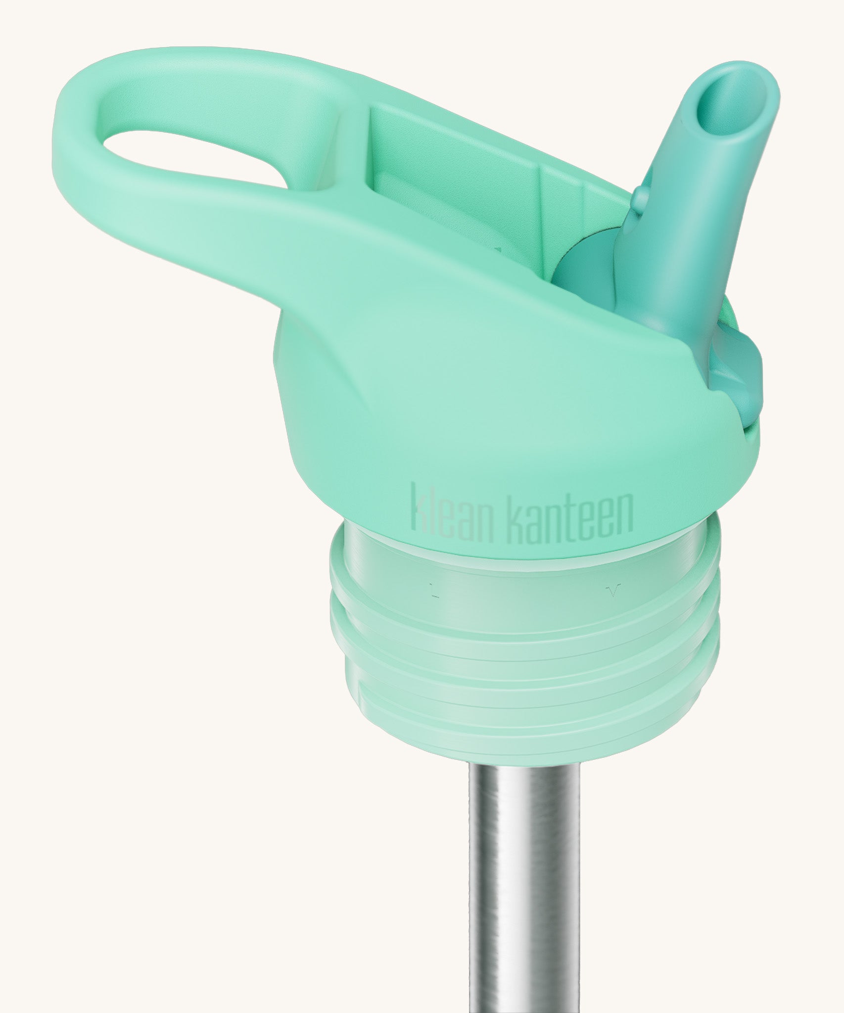 A close up of the Klean Kanteen turquoise flip sports straw cap for the rise insulated bottle showing the dark turquoise spout and small loop detail. 