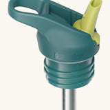 A close up of the Klean Kanteen green and blue flip sports straw cap for the rise insulated bottle showing the turquoise spout and small loop detail. 