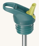 A close up of the Klean Kanteen green and blue flip sports straw cap for the rise insulated bottle showing the turquoise spout and small loop detail. 