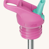 A close up of the Klean Kanteen pink and turquoise insulated flip sports straw cap for the rise insulated bottle showing the turquoise spout and small loop detail. 
