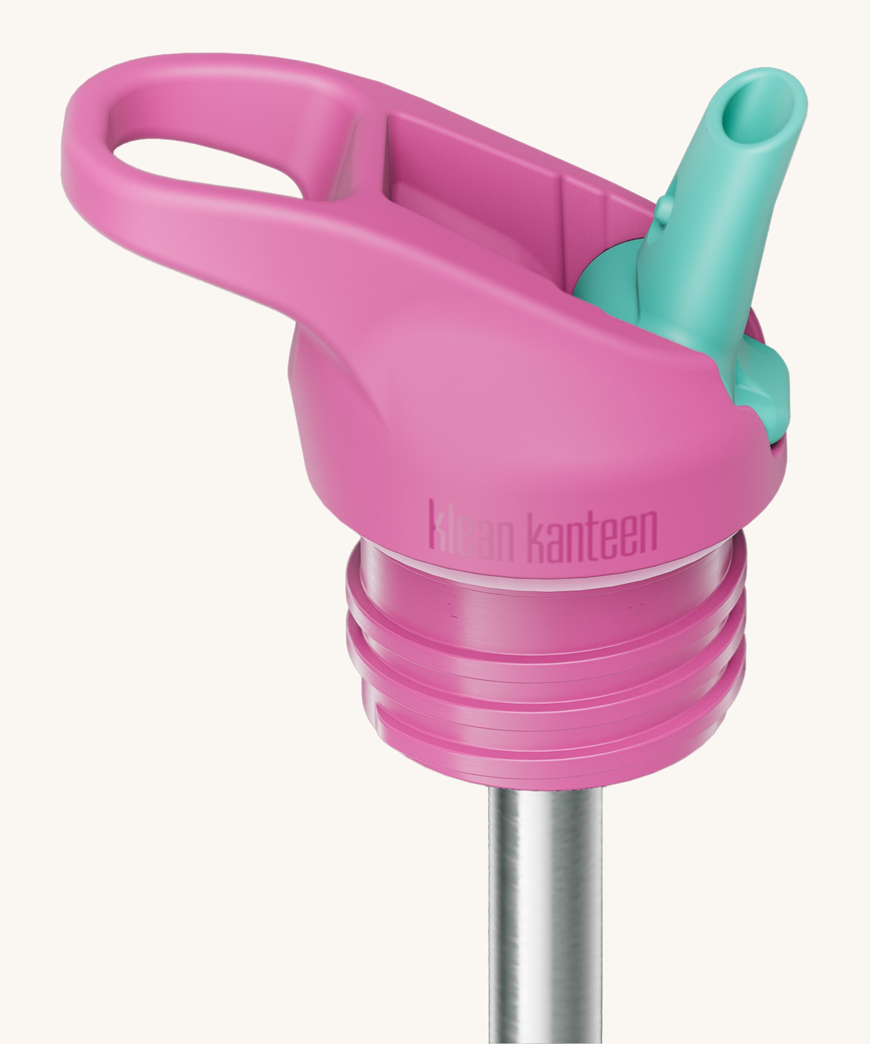 A close up of the Klean Kanteen pink and turquoise insulated flip sports straw cap for the rise insulated bottle showing the turquoise spout and small loop detail. 