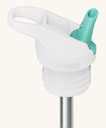 A close up of the Klean Kanteen white and turquoise flip sports straw cap for the rise insulated bottles showing the turquoise spout and small loop detail. 