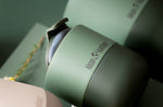 Close up of a dark green Klean Kanteen insulated lowball cup on a green background