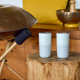 Pair of Klean Kanteen barely blue 16oz stainless steel rise tumblers standing on a wooden table
