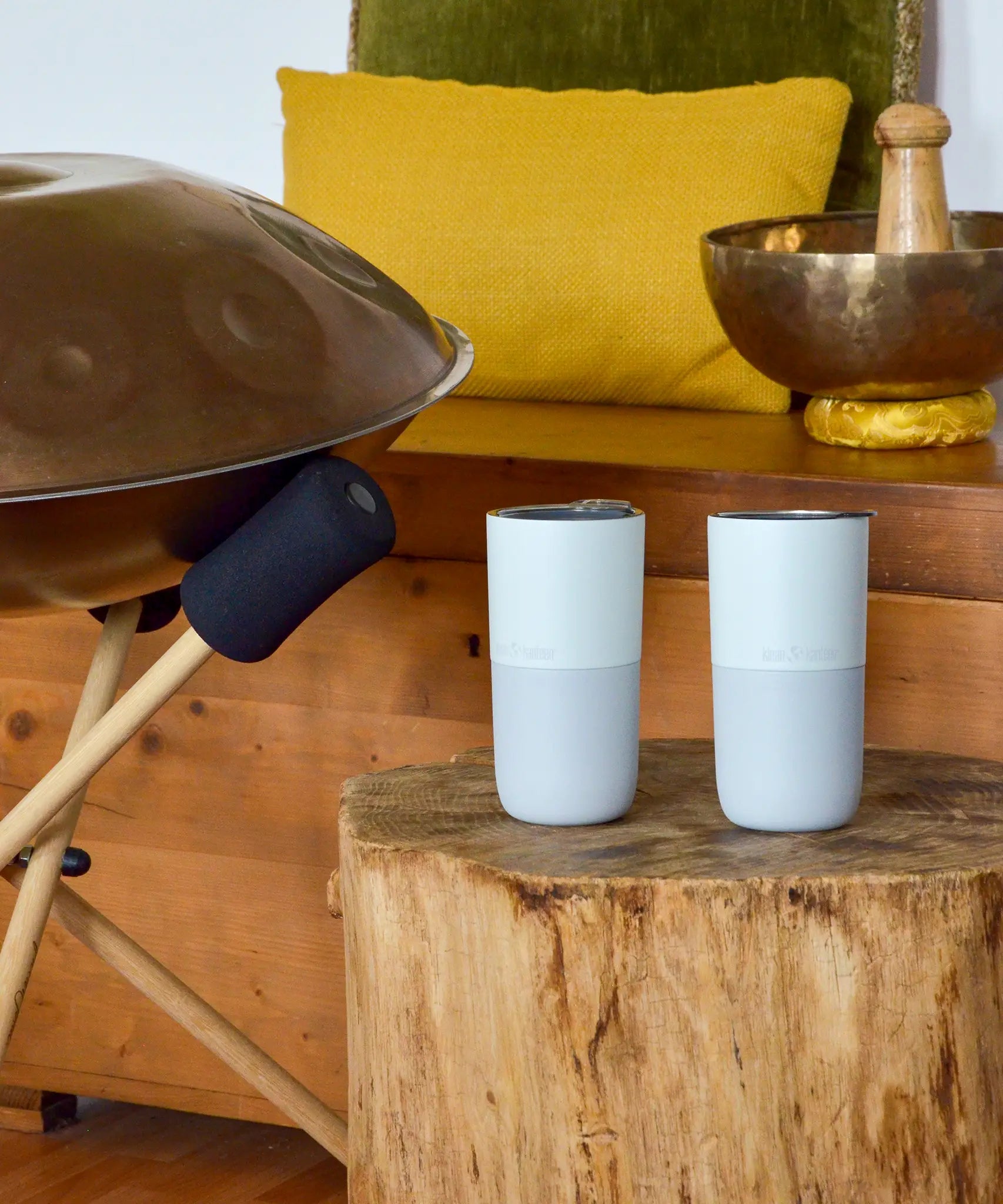 Pair of Klean Kanteen barely blue 16oz stainless steel rise tumblers standing on a wooden table