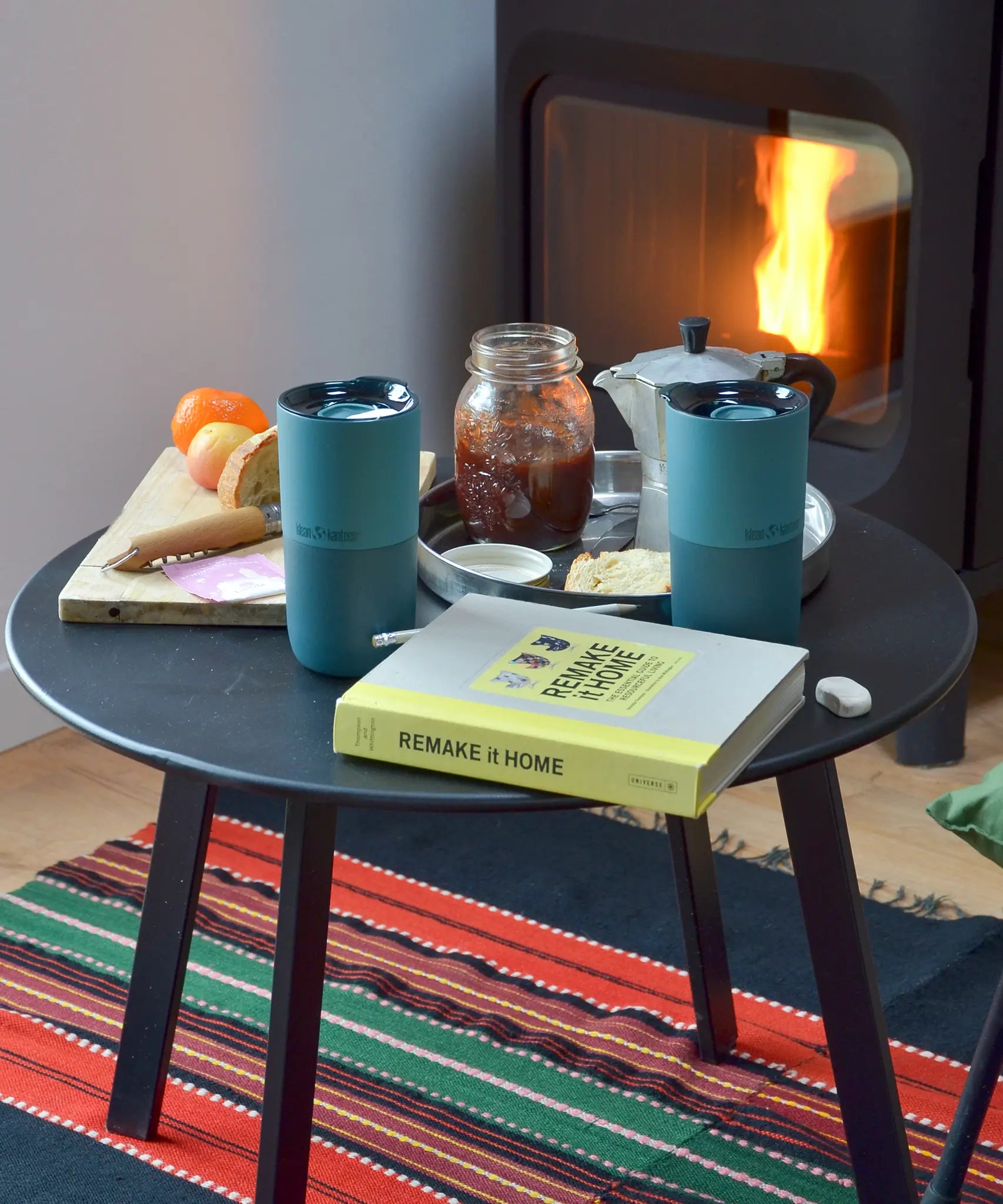 Pair of Klean Kanteen Brittany blue 16oz stainless steel rise tumblers standing on a table next to breakfast items