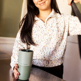Adult grabbing a 16oz Klean Kanteen in iceberg green
