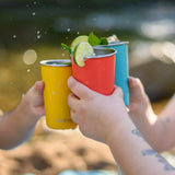 Klean Kanteen stainless steel 16oz pint cups in evening sky colours filled with drink and decorated with limes and garnish, three people making a cheering motion