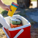 Klean Kanteen stainless steel 16oz pint cups in a 4 Pack in evening sky colours stacked together in a person's hands being placed into a cool box.