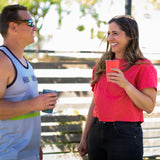 Two people drinking from Klean Kanteen stainless steel 16oz pint cups in evening sky colours .
