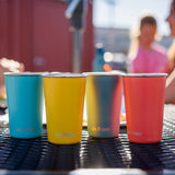 Klean Kanteen stainless steel 16oz pint cups in a 4 Pack in evening sky colours placed on a garden table.