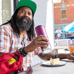 Man sat at a bench holding a Klean Kanteen eco-friendly stainless steel drinks bottle