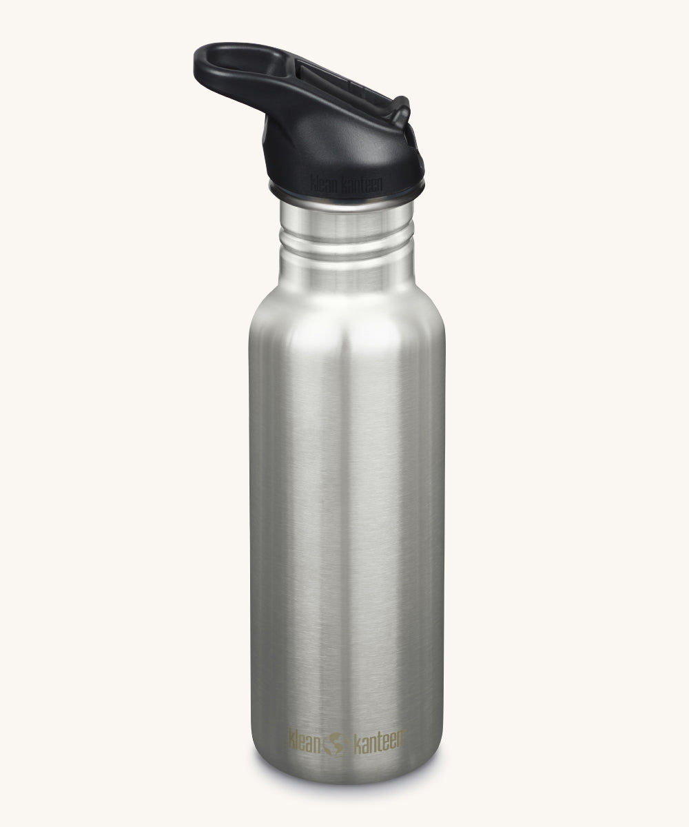 A Klean Kanteen 18oz Classic Narrow Leakproof Flip Seal Sports Cap Reusable Stainless Steel Water Bottle in brushed steel with a black coloured lid.  