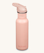 A Klean Kanteen 18oz Classic Narrow Leakproof Flip Seal Sports Cap Reusable Stainless Steel Water Bottle in a light pink peach parfait colour. 