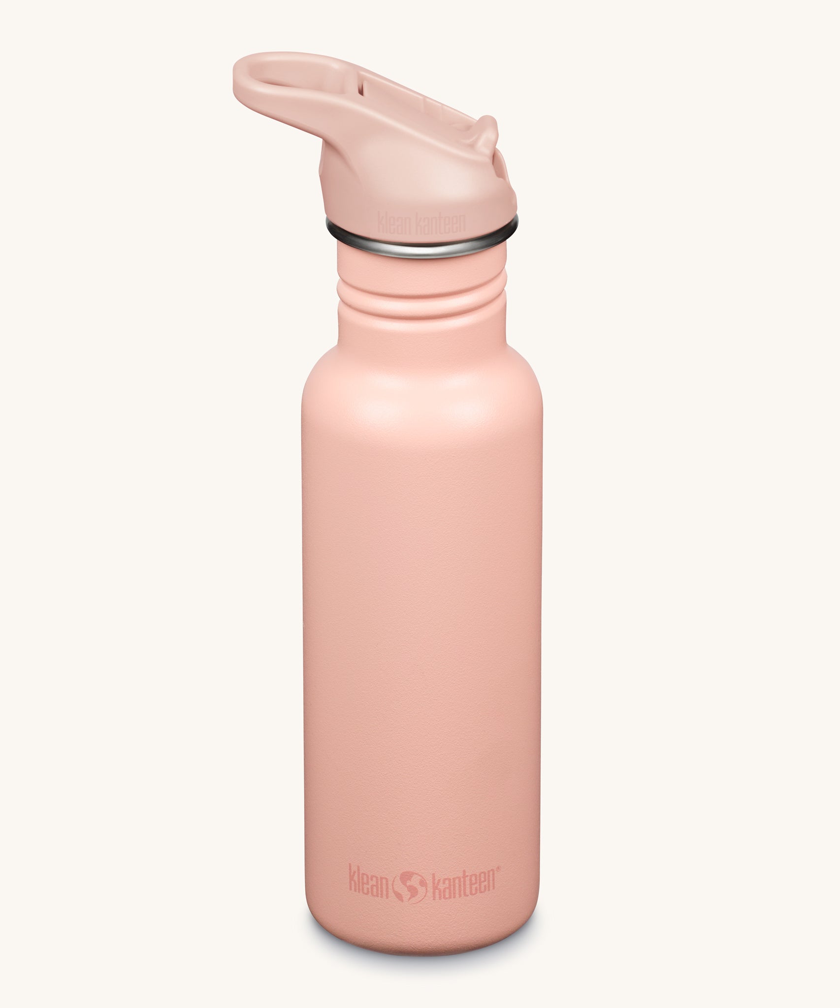 A Klean Kanteen 18oz Classic Narrow Leakproof Flip Seal Sports Cap Reusable Stainless Steel Water Bottle in a light pink peach parfait colour. 
