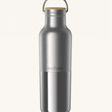 Klean Kanteen 20oz reusable stainless steel reflect water bottle available at Babipur with a smooth top half finish and a glossy bottom half finish. Features a handy loop cap with a bamboo top. 