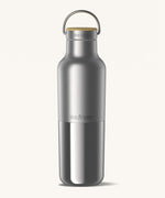 Klean Kanteen 20oz reusable stainless steel reflect water bottle available at Babipur with a smooth top half finish and a glossy bottom half finish. Features a handy loop cap with a bamboo top. 