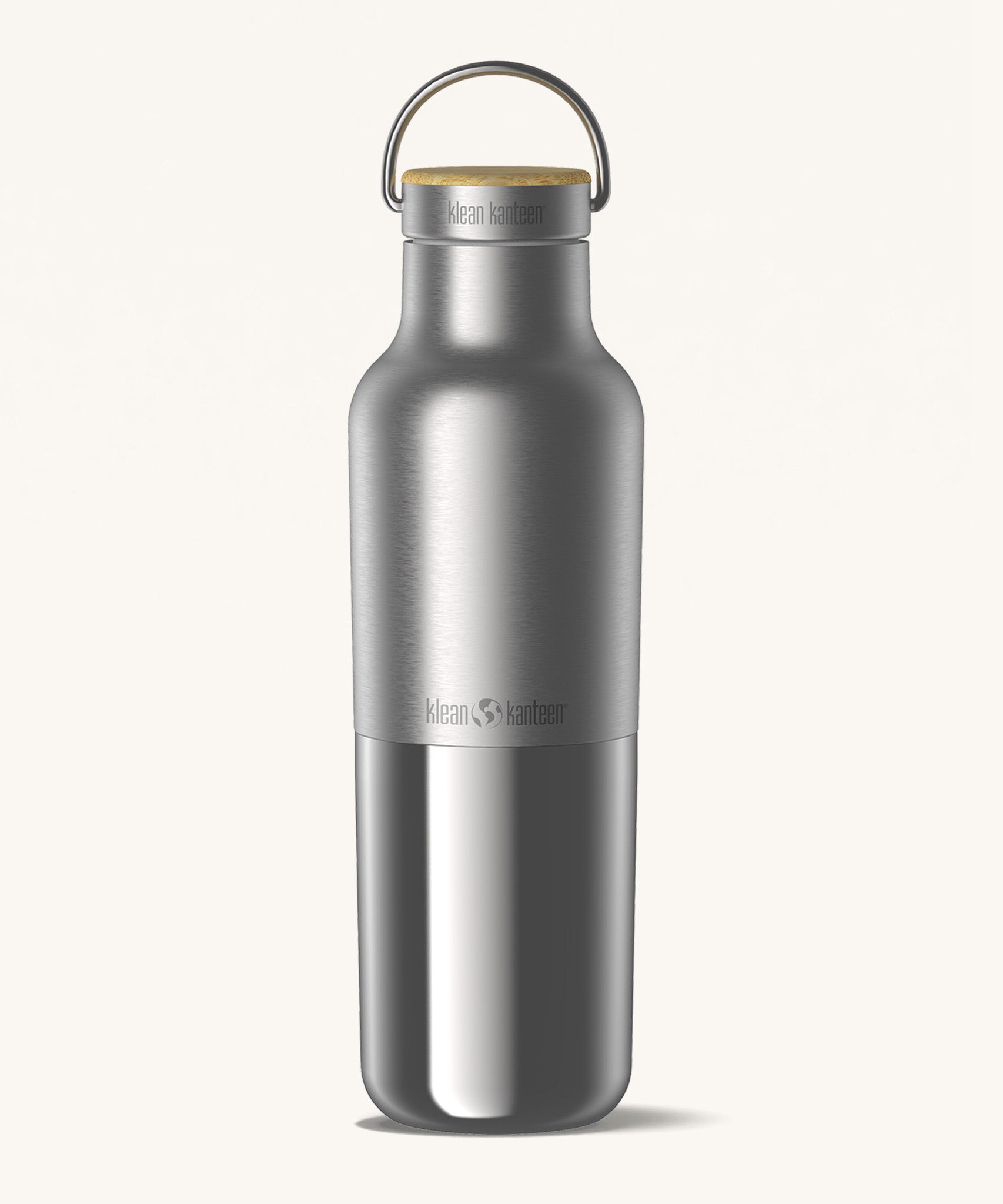 Klean Kanteen 20oz reusable stainless steel reflect water bottle available at Babipur with a smooth top half finish and a glossy bottom half finish. Features a handy loop cap with a bamboo top. 