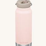 A Klean Kanteen 32oz peach parfait pink coloured TKWide with taupe coloured Twist Straw Cap on a plain background.