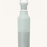 A Klean Kanteen 20oz rise insulated Reusable Stainless Steel Water Bottle in a barely blue colour that's split in a light and dark shade. Features a matching loop cap with a thread and handle for easy carrying
