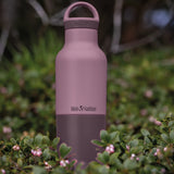 Klean Kanteen 20oz dusty orchid stainless steel  insulated classic bottle on a bed of flowers