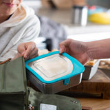 Klean Kanteen 20oz food box being put into a green bag